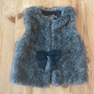 Satin Lined Grey Fur Vest with Black Bow.